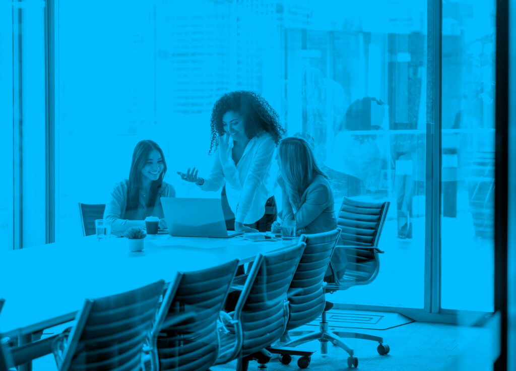 1099Pro SOVOS 1042 vs 1042-S Tax Filing Illustration — professionals reviewing tax forms and compliance deadlines in an office setting